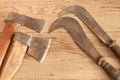 Two dated and used cleavers and billhooks on wooden background Royalty Free Stock Photo