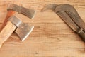 Two dated and used cleavers and billhooks on wooden background Royalty Free Stock Photo