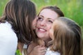 Two daughters, Kiss mom Royalty Free Stock Photo