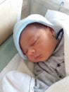 Two days old newborn baby boy, sleeping in hospital cot Royalty Free Stock Photo