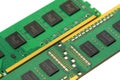 Two DDR RAM memory modules with black chips and gold contacts, closeup macro detail on white background, computer hardware upgrade Royalty Free Stock Photo
