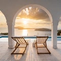 Two deck chairs on terrace with pool with stunning sea view. Traditional mediterranean white architecture with arch. Summer Royalty Free Stock Photo