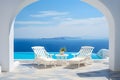 Two deck chairs on terrace with pool with stunning sea view. Traditional mediterranean white architecture with arch. Summer Royalty Free Stock Photo