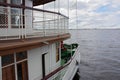 Two-deck ship with flag on river Royalty Free Stock Photo