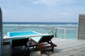 Two deckchair and a pool on the terrace on beautiful bungalow on Royalty Free Stock Photo