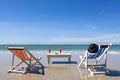 Two deckchairs on the beach for leisure during sunny day Royalty Free Stock Photo