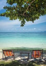 Two deckchairs on the beach in Thailand Royalty Free Stock Photo