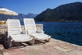 Two deckchairs on the Mediterranean coast Royalty Free Stock Photo