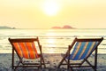 Two deckchairs on a sunny sea beach. Relax. Royalty Free Stock Photo