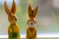 Decoration rabbits stands near a window