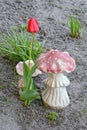 Two decorative ceramic red white figurines in the shape of fly agaric mushrooms