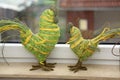 Decorative cockerels on a windowsill Royalty Free Stock Photo