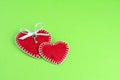 Two decorative  hearts made of red fumirana sewn with a white thread Royalty Free Stock Photo