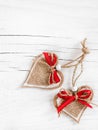 Two decorative hearts on wooden background. Royalty Free Stock Photo