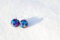 Two decorative spheres on a white snow. Royalty Free Stock Photo