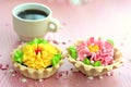 Two delicious cakes with cream and a cup of coffee stand on a pink table Royalty Free Stock Photo