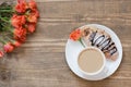 Two delicious freshly baked chocolate croissants and cup of coffee on wooden board. Top view. Breakfast concept. Copy space. Royalty Free Stock Photo