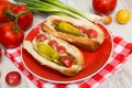 Two Delicious Hot Dogs With Tomato and Pepper