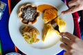 Two delicious indigenous mexican Rolls made with egg omelette with mole and onion Royalty Free Stock Photo