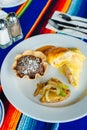 Two delicious indigenous mexican Rolls made with egg omelette with mole and onion Royalty Free Stock Photo