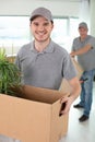 two delivery men carrying cardboard boxes Royalty Free Stock Photo