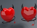 Two devil hearts on black Royalty Free Stock Photo