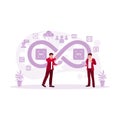Two DevOps software developers and IT operations engineers work in an agile methodology environment using a laptop. Royalty Free Stock Photo