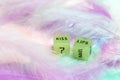 Two dice for erotic sexual game with the text Kiss lips for Valentines Day sex,romantic, sensual concept with pastel colored