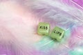 Two dice for erotic sexual game with the text Kiss lips for Valentines Day sex,romantic, sensual concept with pastel colored Royalty Free Stock Photo