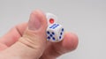 Two dice with numbers in hand. Royalty Free Stock Photo
