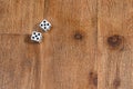 Two dice on wooden background