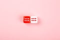 Two dices with hearts on pink background Royalty Free Stock Photo