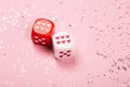Two dices with hearts on pink background Royalty Free Stock Photo