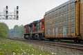 Two Diesel Engines Haul Freight Cars Westward At Georgetown, Ontario Royalty Free Stock Photo