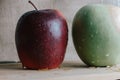 two different apples on slate and rustic background, raw food