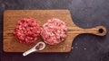 Two Different Balls Of Minced Meat: Beef And Pork Got Placed On A Wooden Board Separately. Culinary Preparation. Hamburger Royalty Free Stock Photo