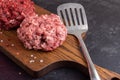 Two Different Balls Of Minced Meat: Beef And Pork Got Placed On A Wooden Board Separately. Culinary Preparation. Hamburger Royalty Free Stock Photo