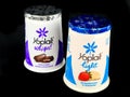 Two Different Brands of Yoplait Yogurts on a Black Backdrop