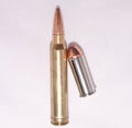 Two different bullets, a .300 Winchester Magnum for a rifle and a .44 special for a handgun Royalty Free Stock Photo