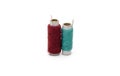 Two different color yarn threads spools on an isolated white background Royalty Free Stock Photo