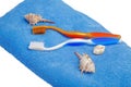 Two different-colored tooth brushes on towel isolated Royalty Free Stock Photo