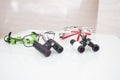 Two different glasses-microscope dentist, glasses binoculars magnifying. lying on the table Royalty Free Stock Photo