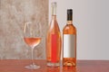 Two different kind of bottles of Rose wine and one glass Royalty Free Stock Photo