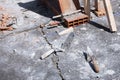 Various masonry and brickwork tools being used on a construction site