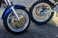 Two motorbikes wheels standing next to each other. Royalty Free Stock Photo