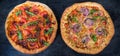 Two different pizza with cheese-filled bumpers on black surface Royalty Free Stock Photo