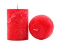 Two red wax candles different in diameter and shape isolated on white background Royalty Free Stock Photo