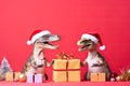 Two dinosaurs Rex in red Santa Claus hat holds golden gift box in its paws on pink background New Years Eve or Christmas Eve Art h Royalty Free Stock Photo