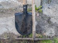 Two dirty and used garden tools, shovel and rake Royalty Free Stock Photo