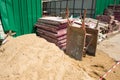 Two dirty wheelbarrows,sand and construction equipment at Construction site.